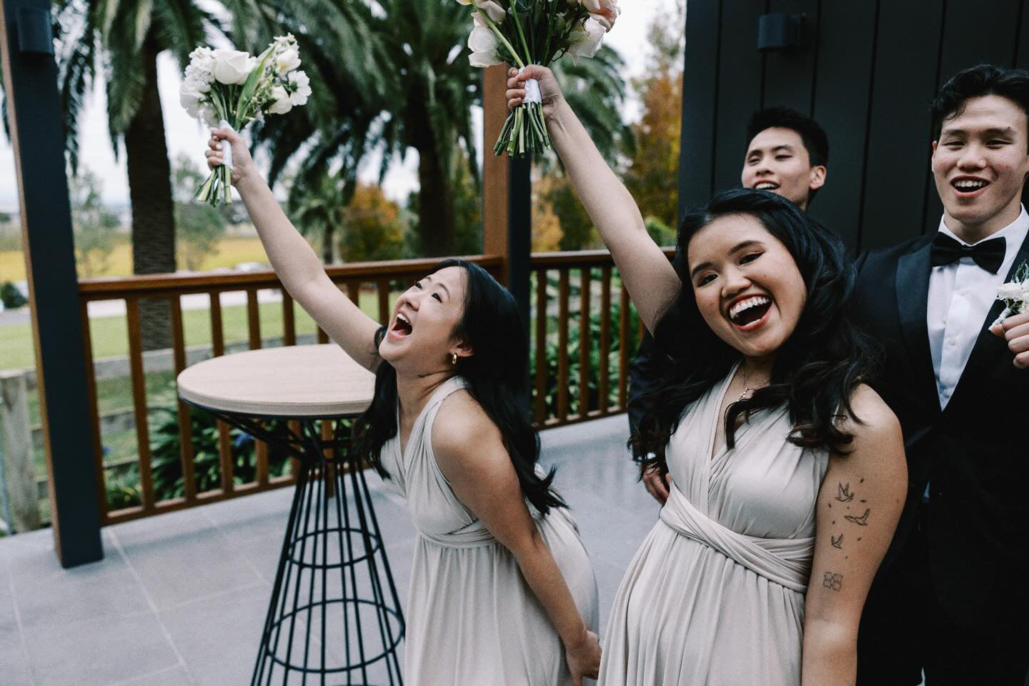 Joyful group celebrating in champagne bridesmaid gown, showcasing a convertible dress Australia