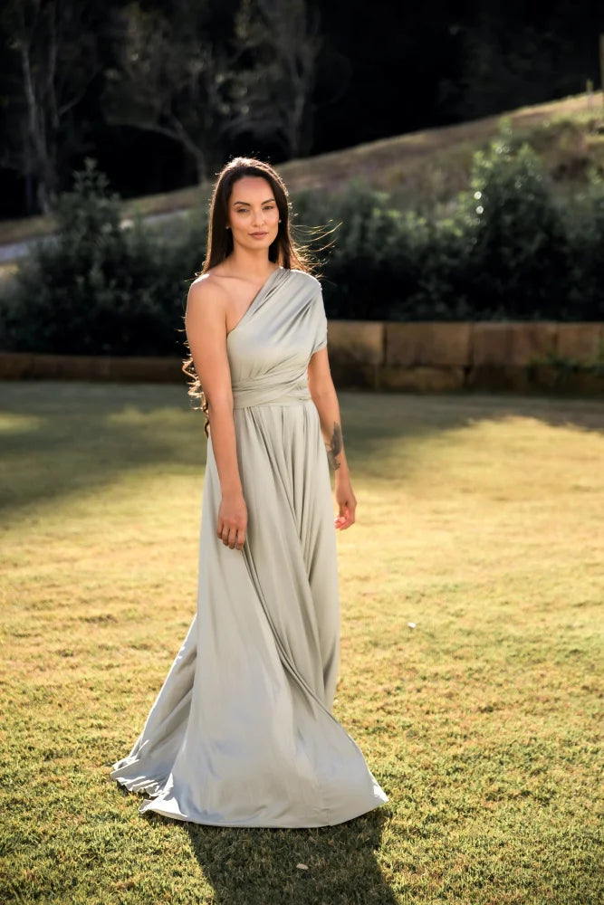 Full-length light green Eucalyptus Infinity Gown convertible dress worn by a woman