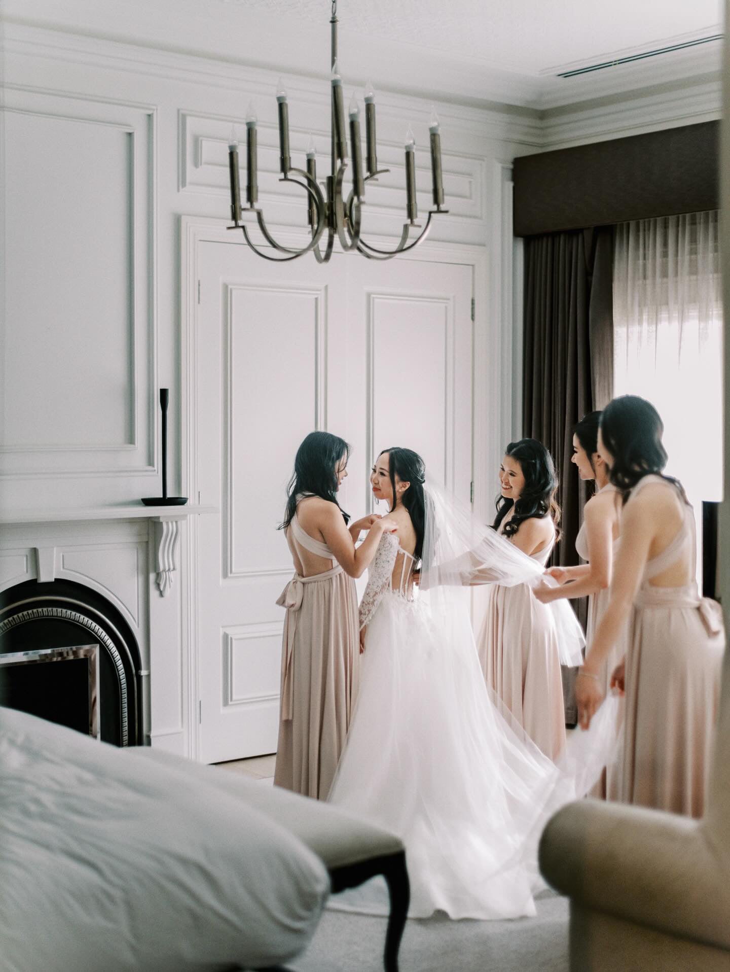 Bride in a white gown with bridesmaids in beige champagne bridesmaid gown, convertible dress Australia