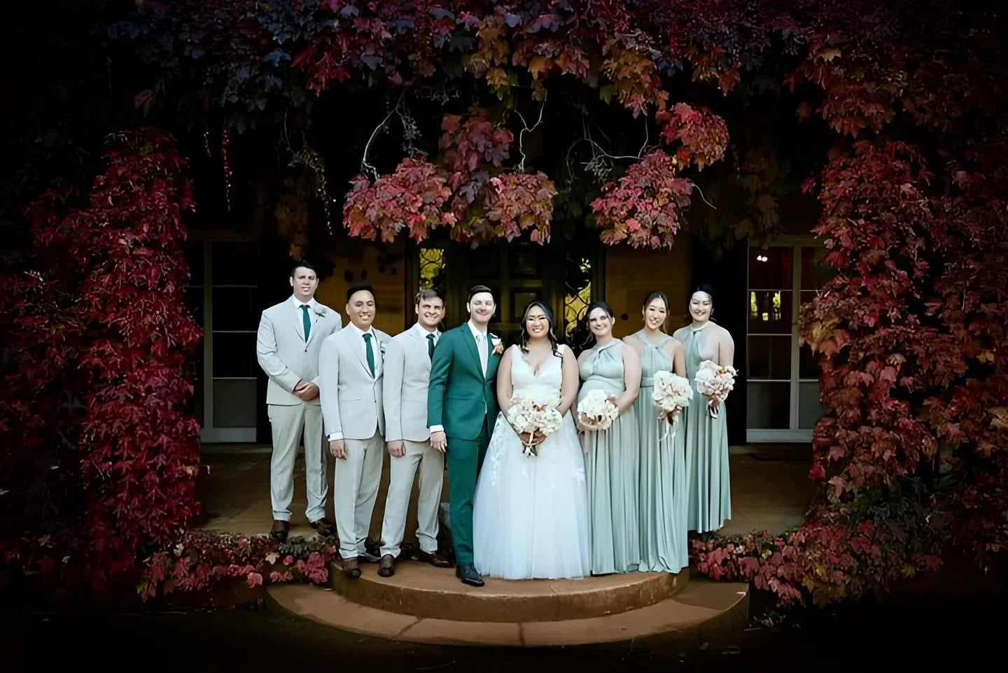 Wedding party outdoors in autumn leaves wearing Eucalyptus Infinity Gown convertible dress