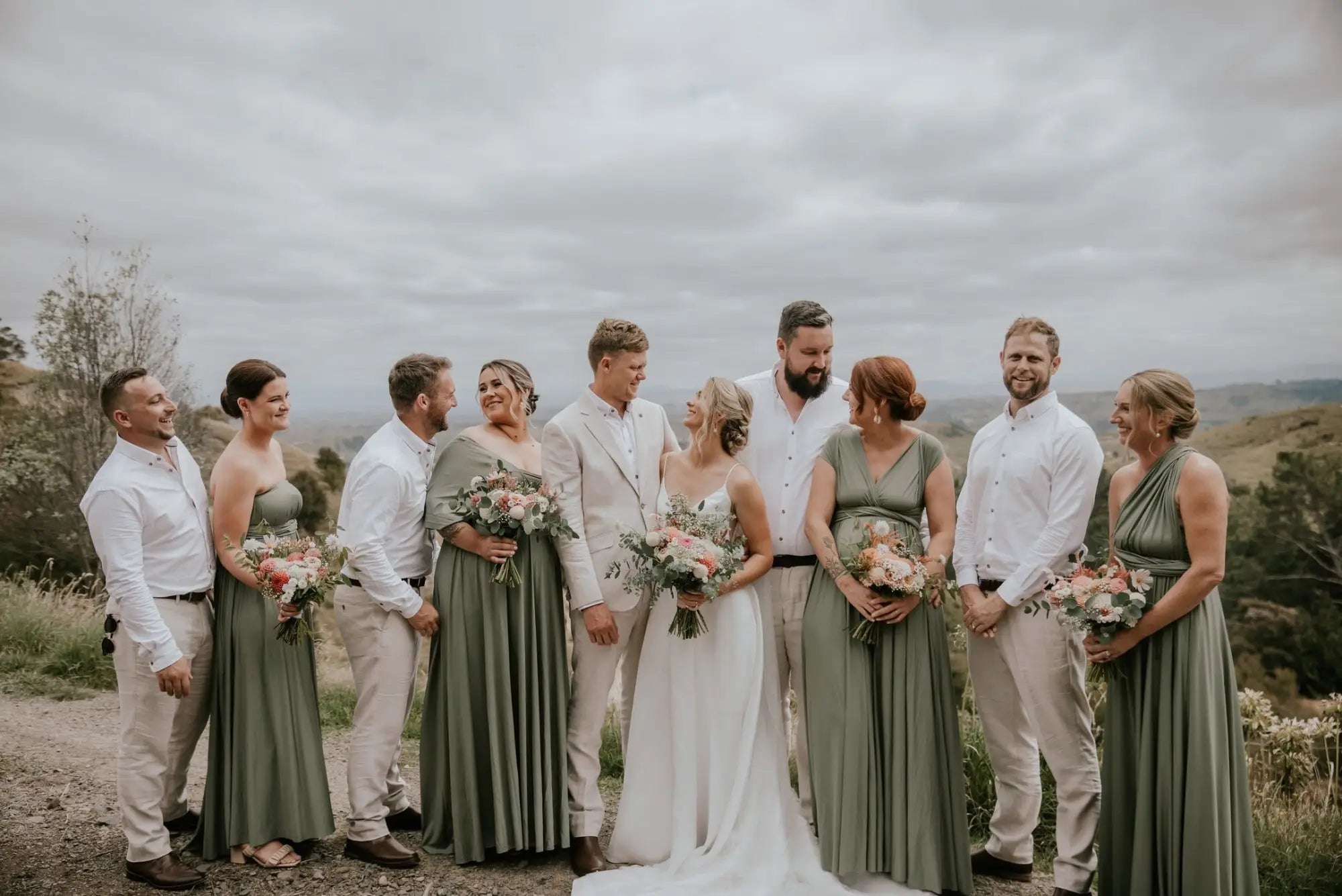 Wedding party in outdoor attire with infinity bridesmaid dresses at Charlotte and Joel