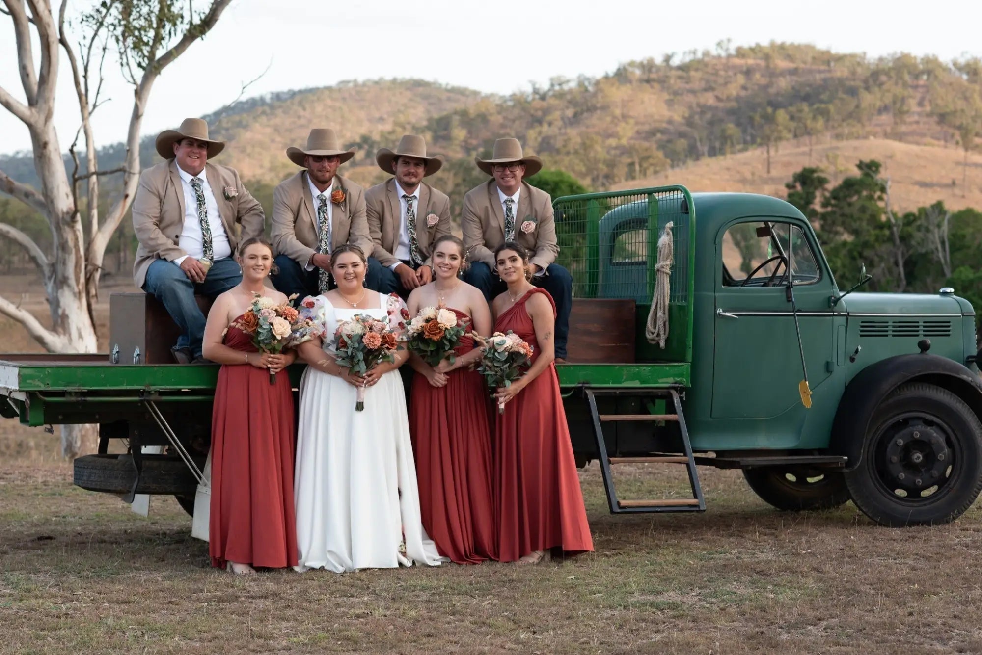 Wedding party with vintage green flatbed truck and infinity dress Australia at Jaime and John