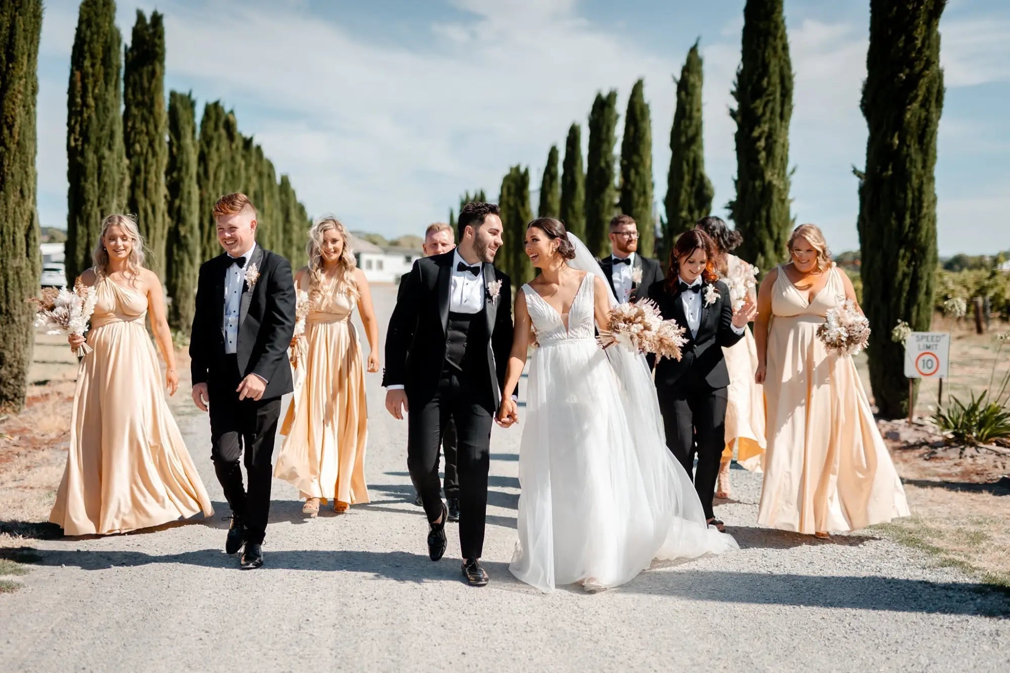 Wedding party outdoors in Luxe Satin Lemon Yellow with infinity bridesmaid dresses in Australia
