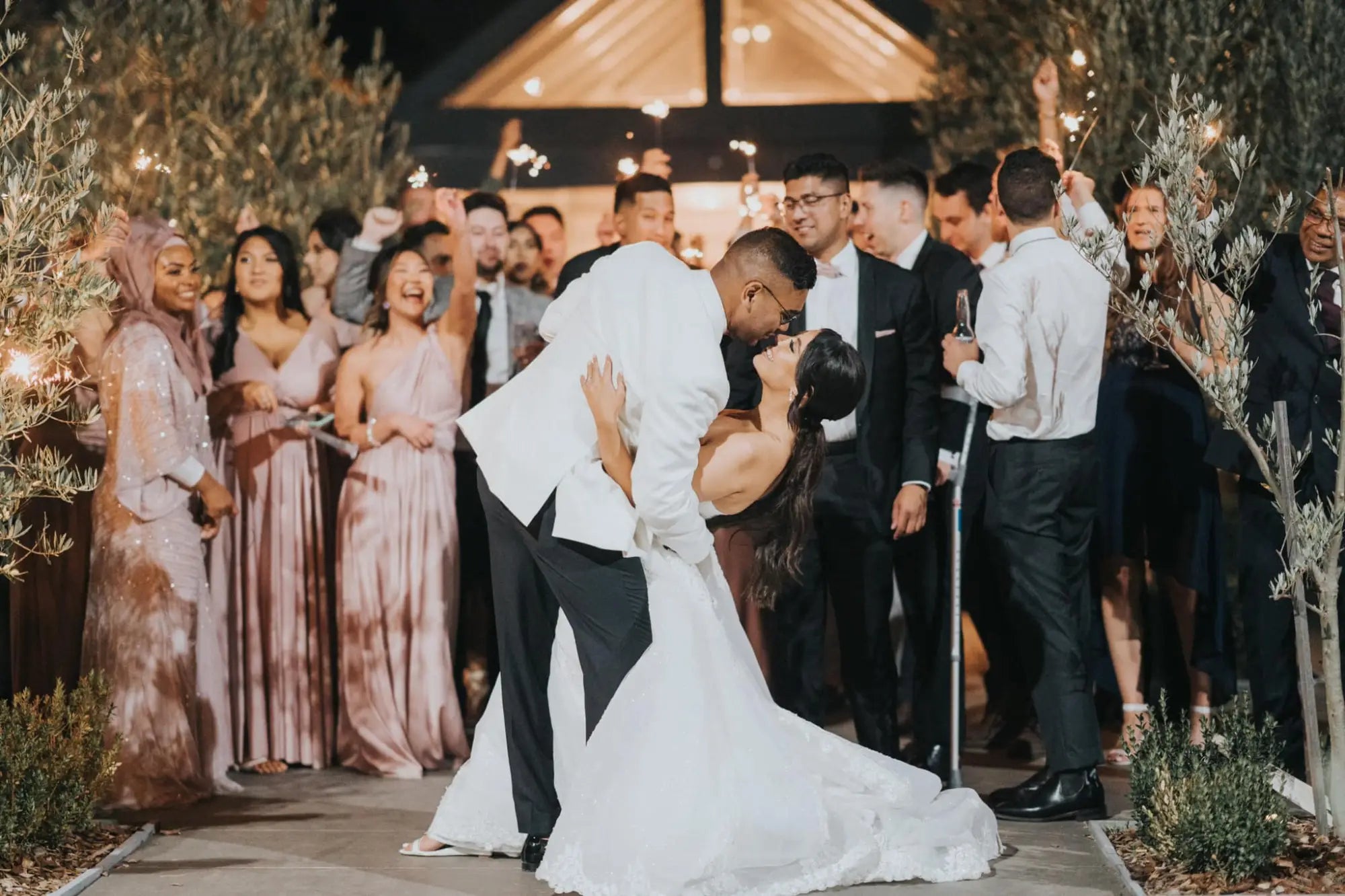 Wedding couple kissing and embracing in infinity dress Australia for Renee and Irfan