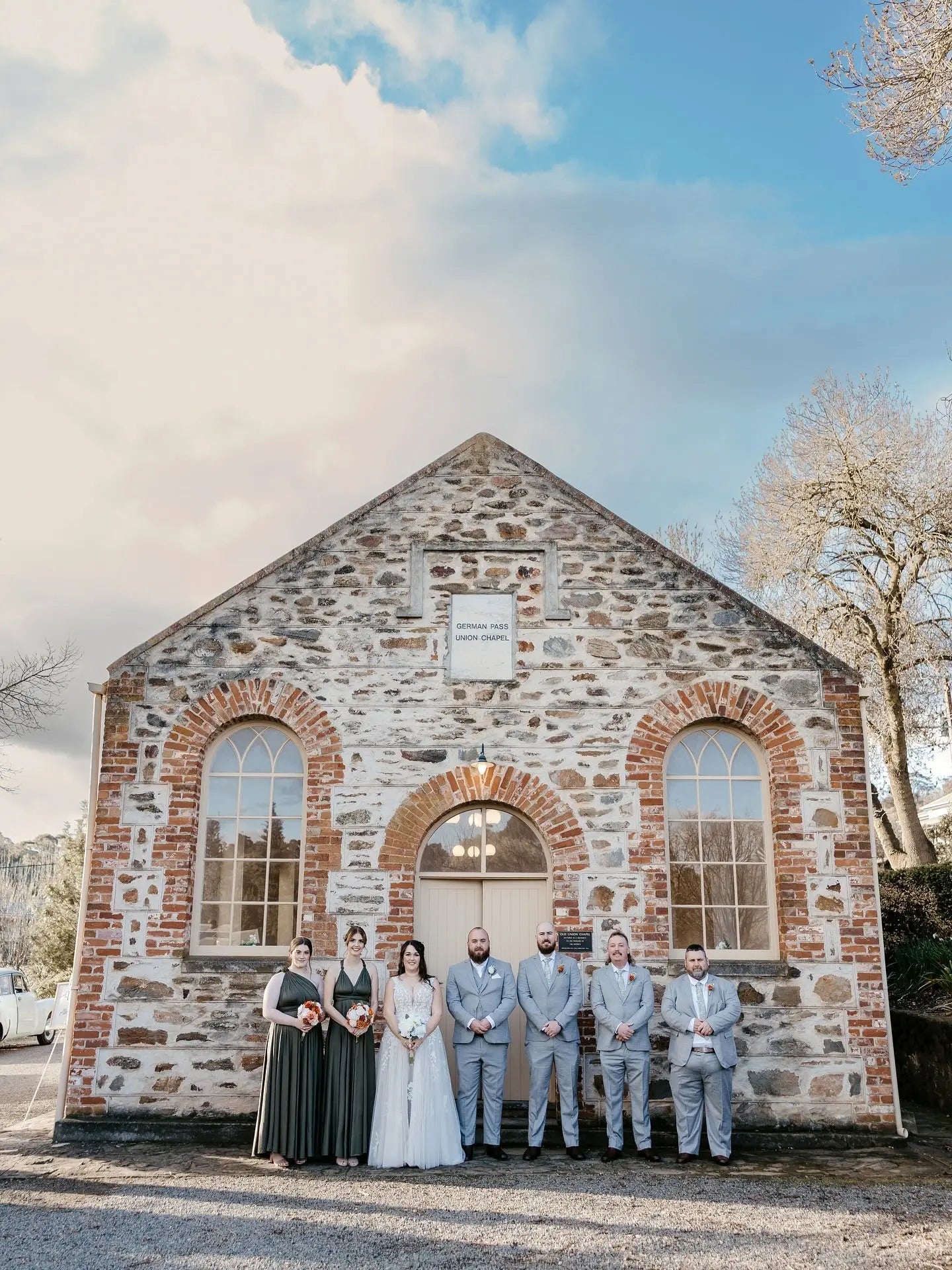 Stone-built wedding venue with arched windows perfect for events and infinity bridesmaid dresses