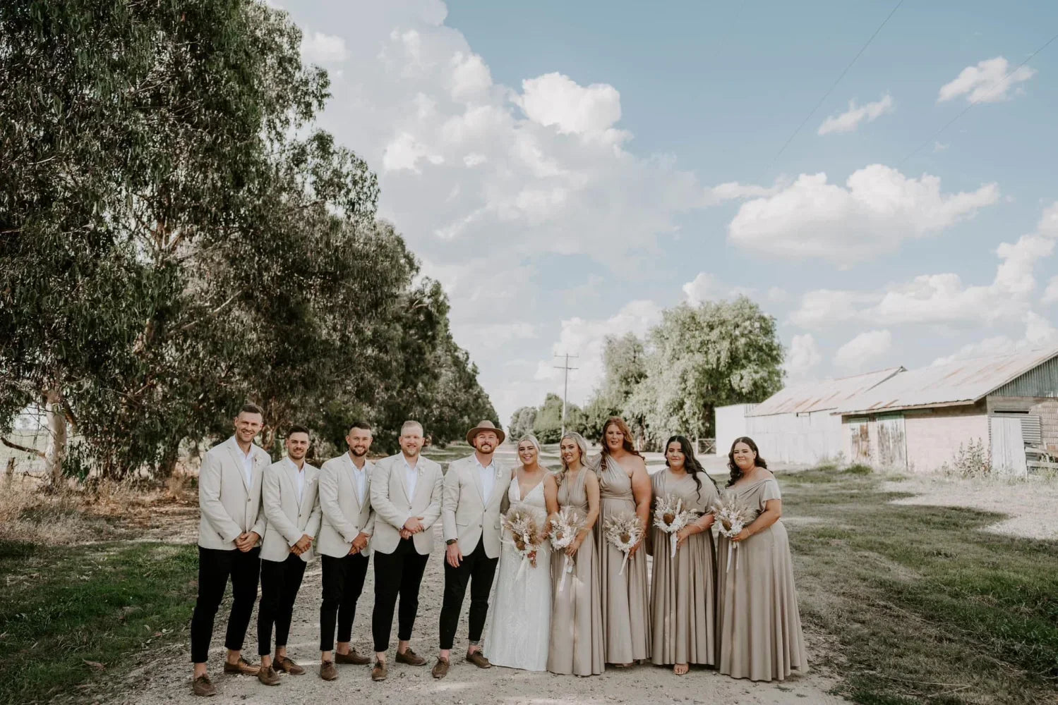 Wedding party in formal attire wearing Gold Infinity Gown, perfect bridesmaid dress Australia