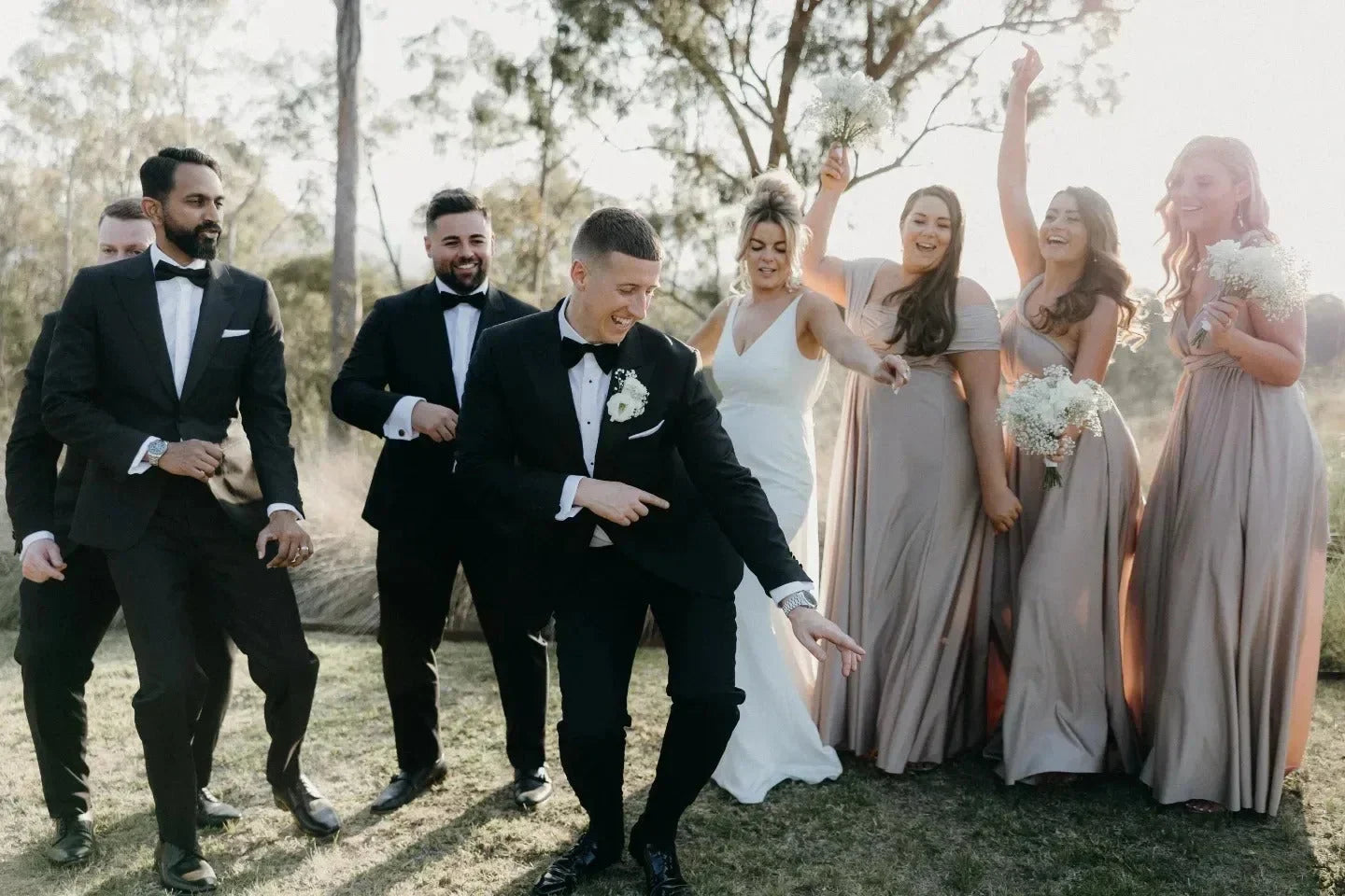 Wedding party outdoors in Gold Infinity Gown showcasing multiway bridesmaid dress Australia style